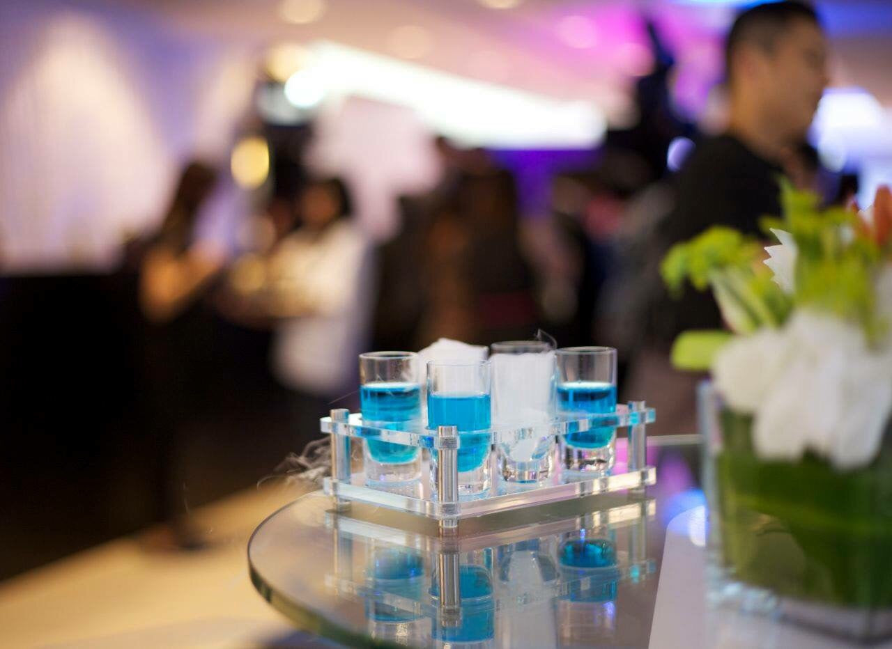 Bright blue cocktails in shooter glasses