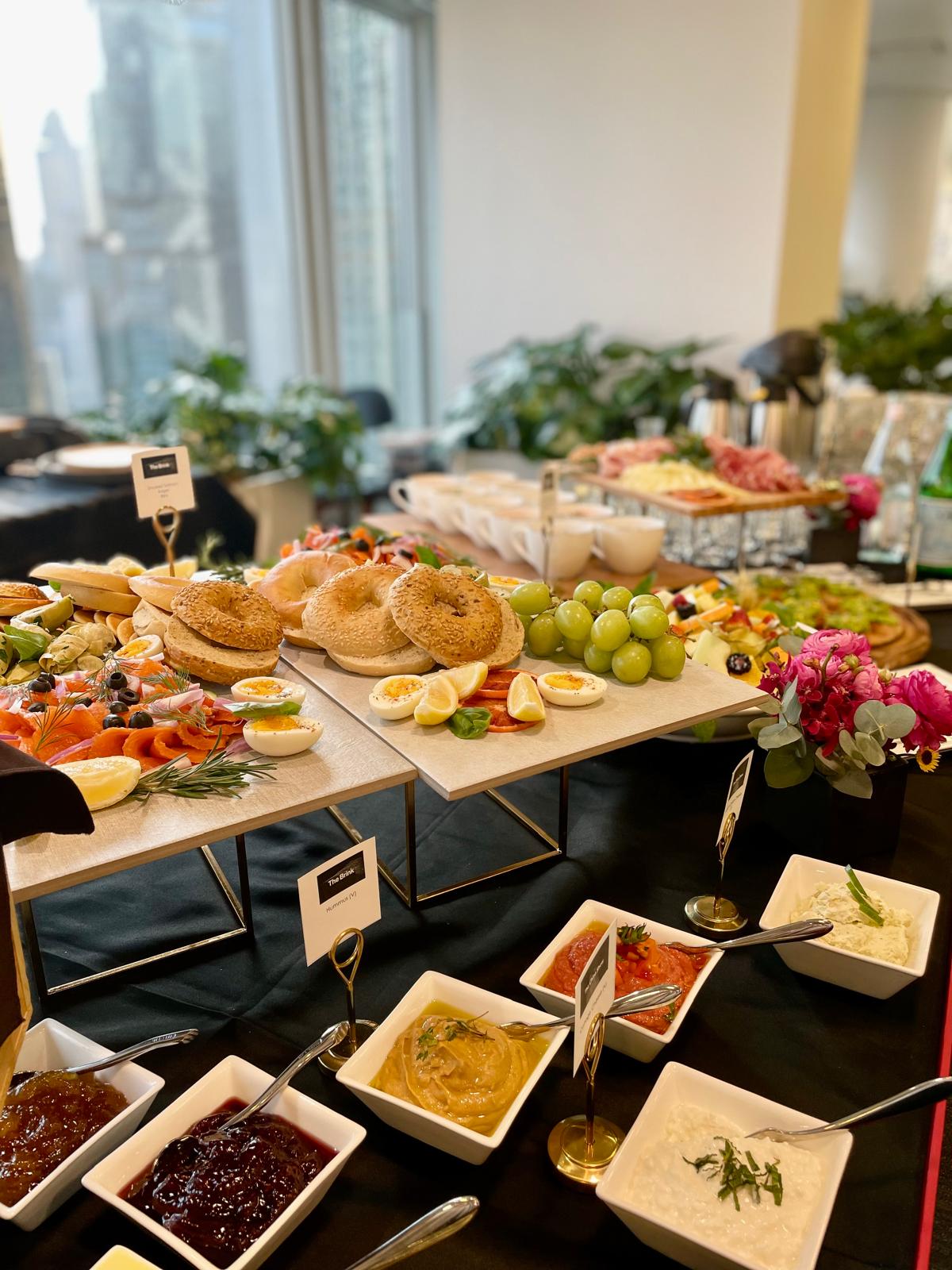 A breakfast buffet spread at a catered corporate lunch event
