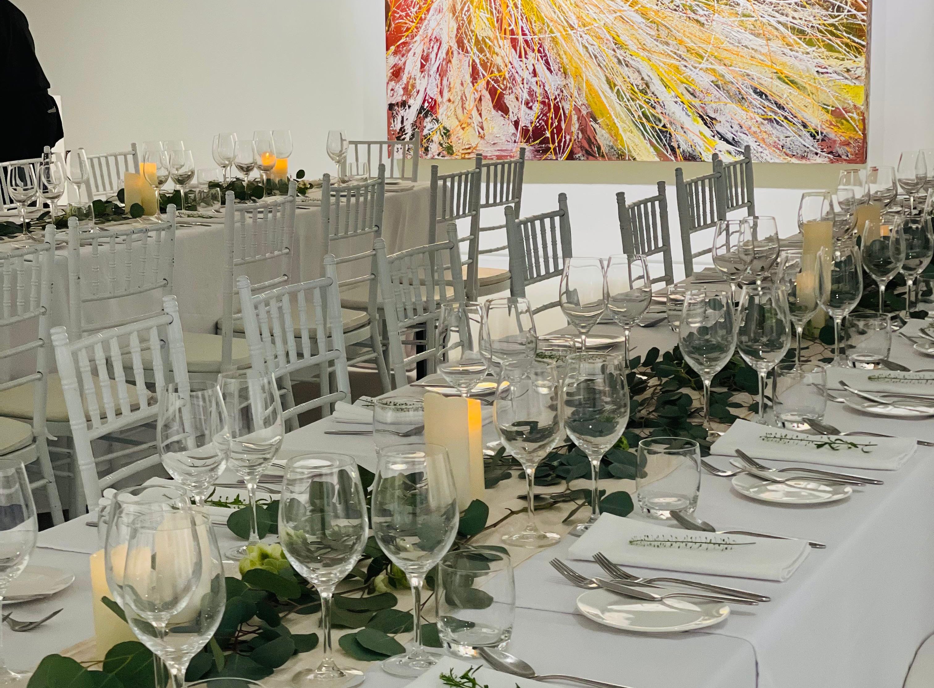 Dinner table set up at a gallery